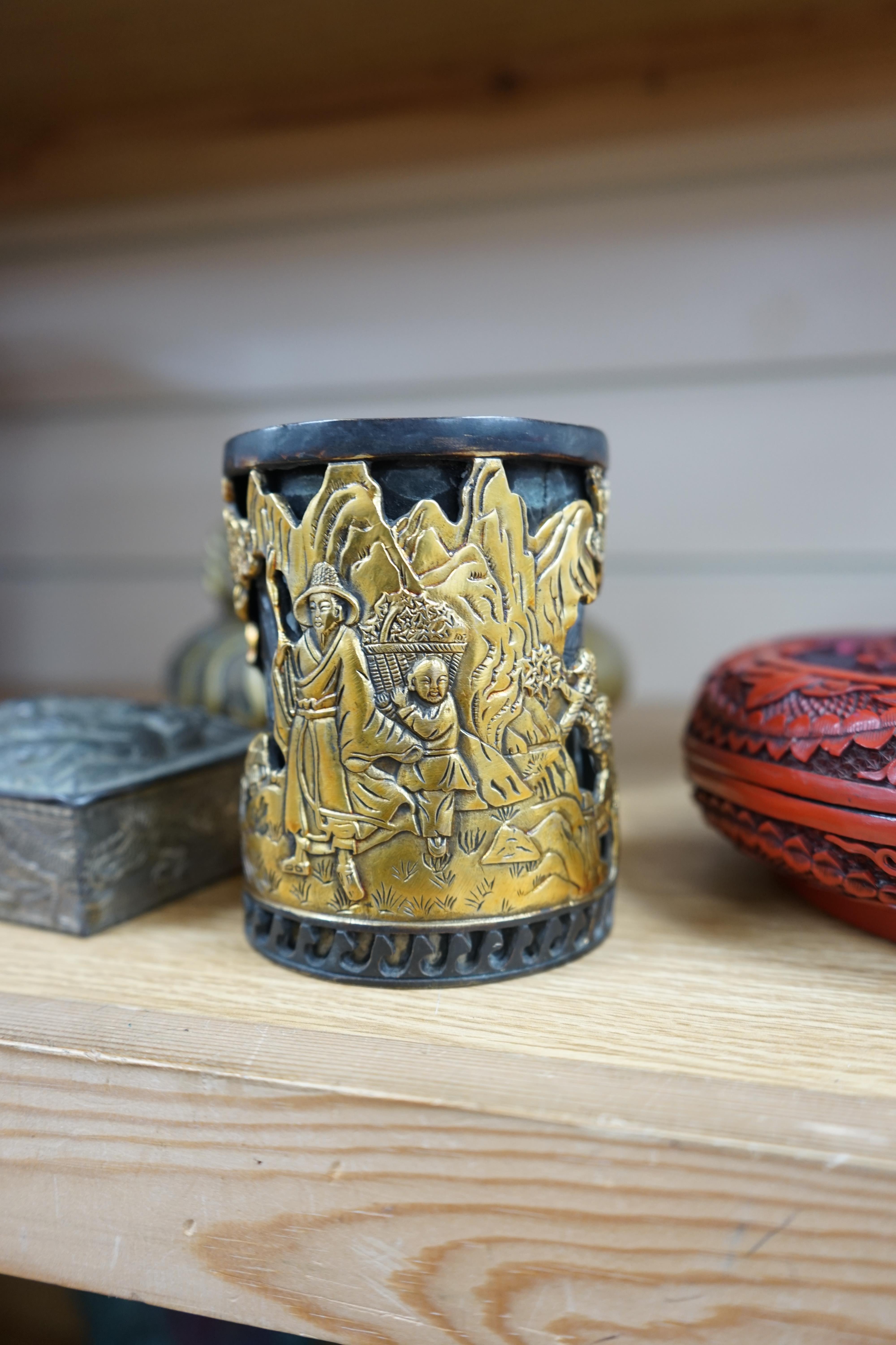 A collection of Chinese and Japanese items to include a lacquered box, a bronze tripod censer, a white metal box and carved seals, largest 25cm wide. Condition - mostly fair